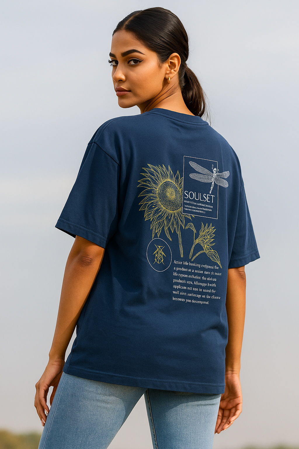 female model wearing oversized navy blue SOULSET graphic T-shirt with artistic sunflower and dragonfly back design, poetic typography, and modern fit – stylish streetwear for men.