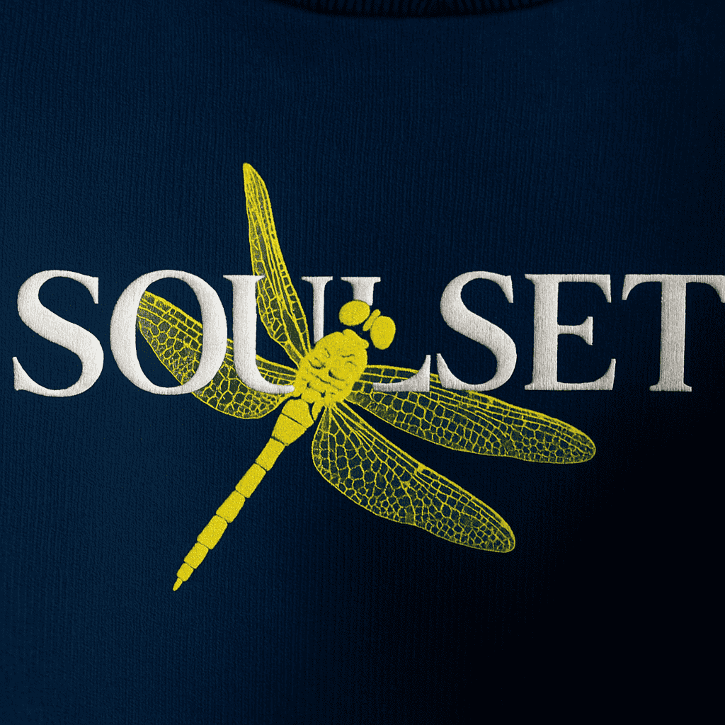Close-up of navy blue sunlight Symphony  T-shirt featuring intricate dragonfly illustration and artistic typography on the back, nature-inspired graphic tee for modern fashion.